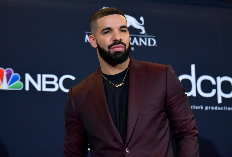 FILE - This May 1, 2019 file photo shows Drake at the Billboard Music Awards in Las Vegas.  Drake is the leading nominee at the 2020 BET Awards, which will celebrate its 20th anniversary later this month. BET announced Monday that Drake is nominated for six honors, including video of the year and best male hip-hop artist. For both best collaboration and the viewer's choice award, Drake is nominated twice thanks to the hits "No Guidance" with Chris Brown and "Life Is Good" with Future. (Photo by Richard Shotwell/Invision/AP, File)