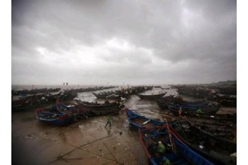Fishermen take stock of their vessels in the wake of Typhoon Megi. While the storm caused major damage in the Asia Pacific region, one reader argues it could have been worse without adequate preparation