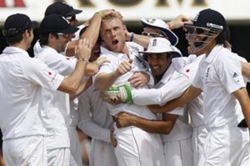 The England team mob five-wicket hero Andrew Flintoff, centre, who was making his final Test bow at Lord's.
