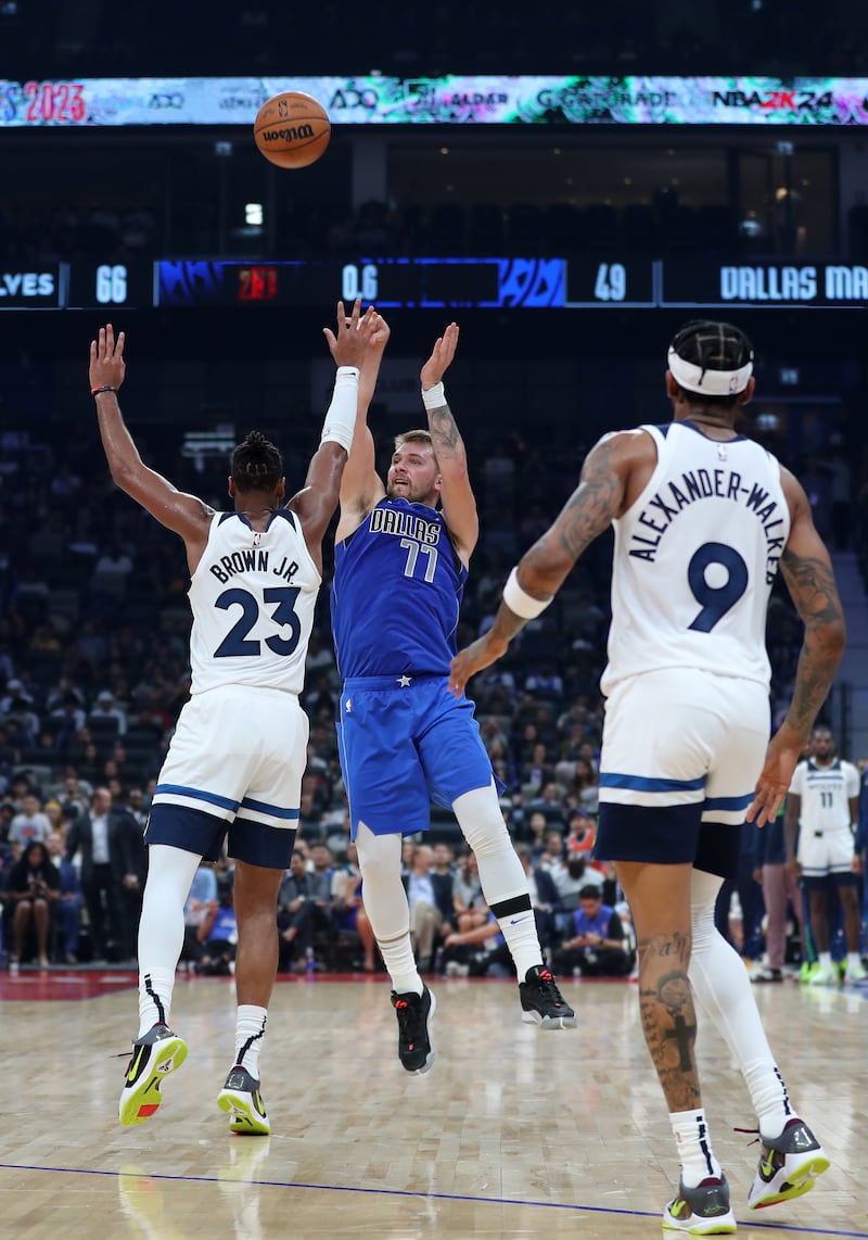 Luka Doncic of Dallas shoots during the game between the Minnesota Timberwolves and Dallas Mavericks.