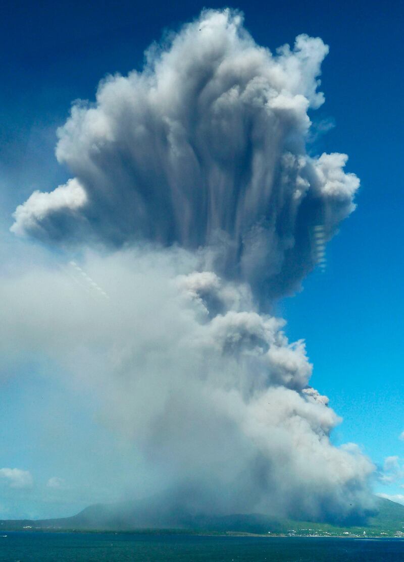 Smoke rises after an eruption of Mount Sakurajima in Kagoshima, southwestern Japan, in this photo taken through a window by Kyodo August 18, 2013. The eruption on Sunday of the 1,117-metre (3665-feet) high volcano, one of Japan's most active volcanoes, sent up the highest plume in recorded history of about 5,000 metres (16,404 feet). It is also the volcano's 500th eruption this year, according to media reports citing the local meteorological observatory. REUTERS/Kyodo (JAPAN - Tags: ENVIRONMENT TPX IMAGES OF THE DAY) 

ATTENTION EDITORS - THIS IMAGE WAS PROVIDED BY A THIRD PARTY. FOR EDITORIAL USE ONLY. NOT FOR SALE FOR MARKETING OR ADVERTISING CAMPAIGNS. THIS PICTURE IS DISTRIBUTED EXACTLY AS RECEIVED BY REUTERS, AS A SERVICE TO CLIENTS. MANDATORY CREDIT. JAPAN OUT. NO COMMERCIAL OR EDITORIAL SALES IN JAPAN. YES *** Local Caption ***  TOK100_JAPAN-_0818_11.JPG