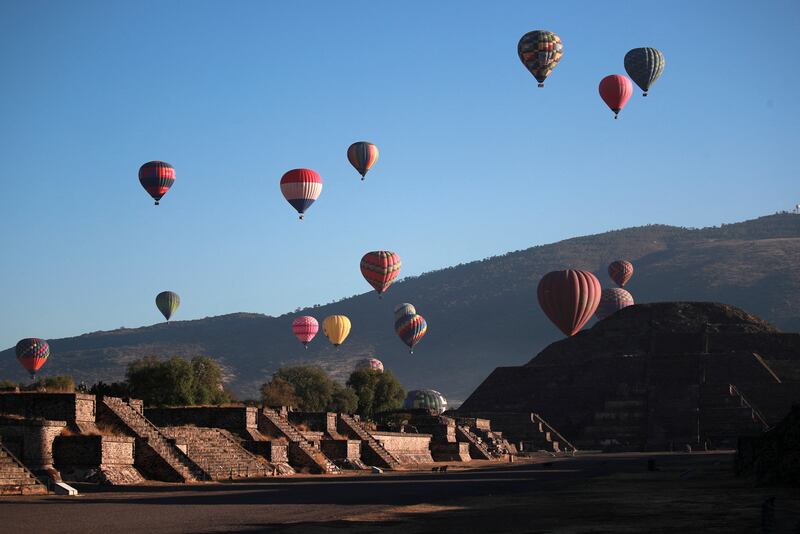 Hot air balloons float above the Pyramid of the Moon in Teotihuacan in Mexico City. Reuters