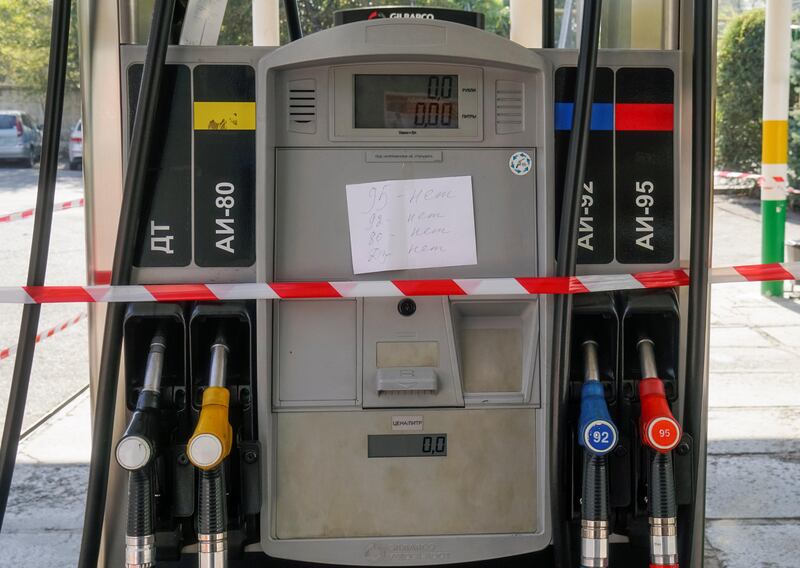 A sealed fuel pump with a note informing about lack of different kinds of fuel is seen at a gas station closed due to fuel shortage in Almaty, Kazakhstan October 10, 2017.  REUTERS/Shamil Zhumatov