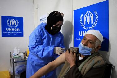A Syrian refugee receives a dose of Covid-19 vaccine at a medical centre in the Zaatari refugee camp. EPA