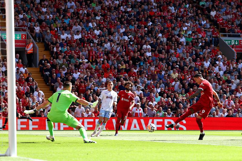 Liverpool striker Darwin Nunez fires in shot that hits post and leads to an own goal scored by Villa defender Matty Cash. Getty