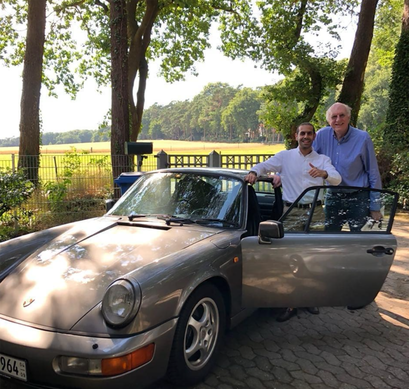 Al Sarkal (left) with a Porsche 964 he got in Germany. Marwan Jassim Al Sarkal / Instagram