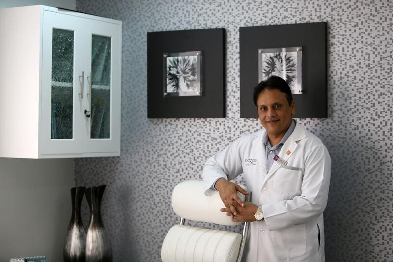 Dubai plastic surgeon Dr Sanjay Parashar in his Dubai office. He will fly to India next month to perform operations for free.  Pawan Singh / The National