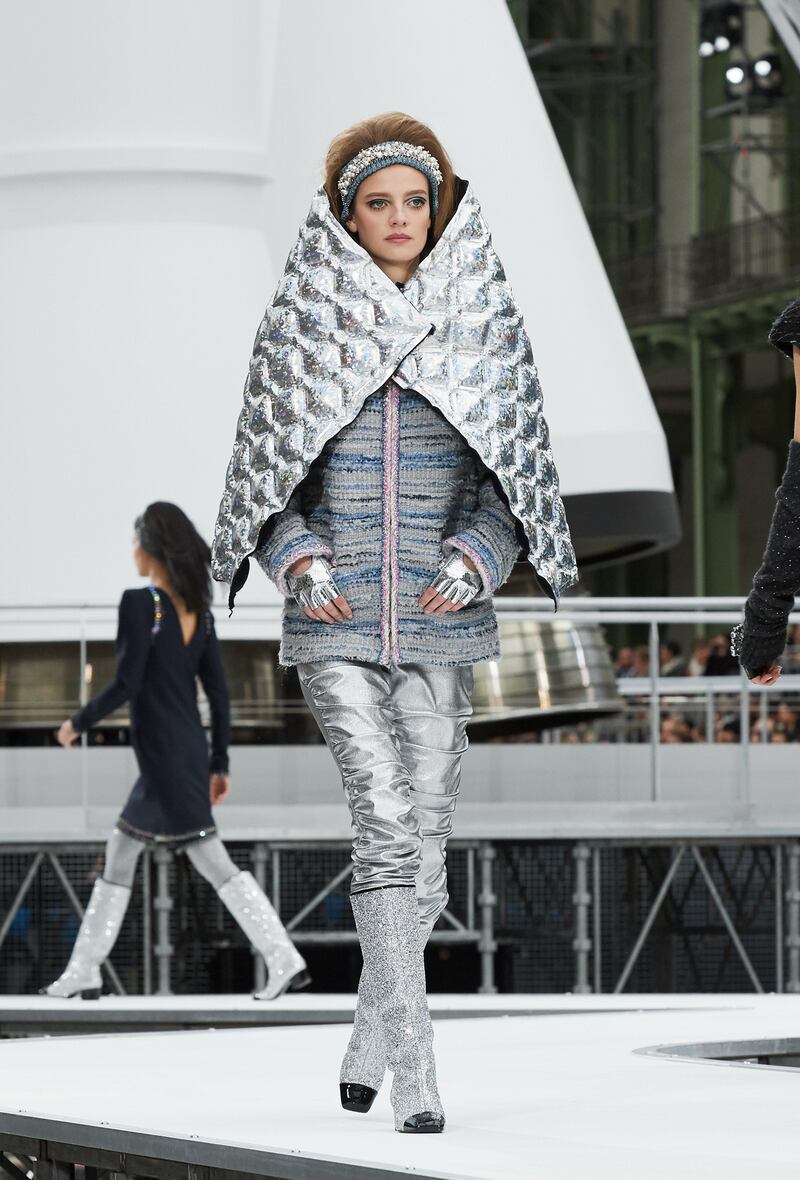 Chanel seems to have concocted this quilted metallic cape, which encases the body from ear to elbow, for an astronaut.