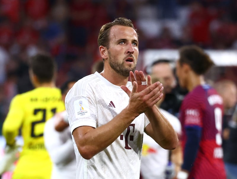 Harry Kane applauds the crowd after the German Super Cup. Reuters