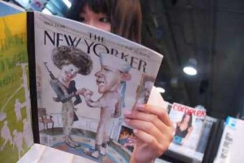 Vickie Han looks at The New Yorker magazine at a news-stand in Manhattan.