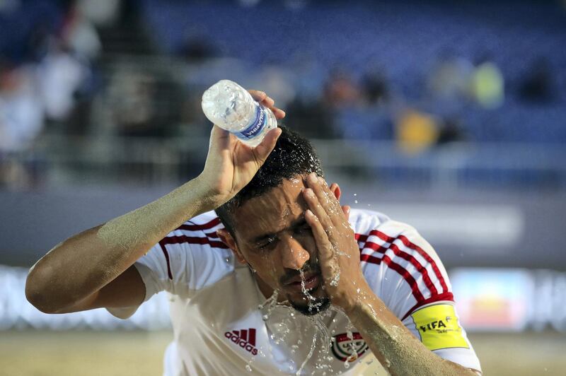 Dubai, United Arab Emirates - November 05, 2019: The UAE's gets sand out of his eyes during the game between the UAE and Spain during the Intercontinental Beach Soccer Cup. Tuesday the 5th of November 2019. Kite Beach, Dubai. Chris Whiteoak / The National