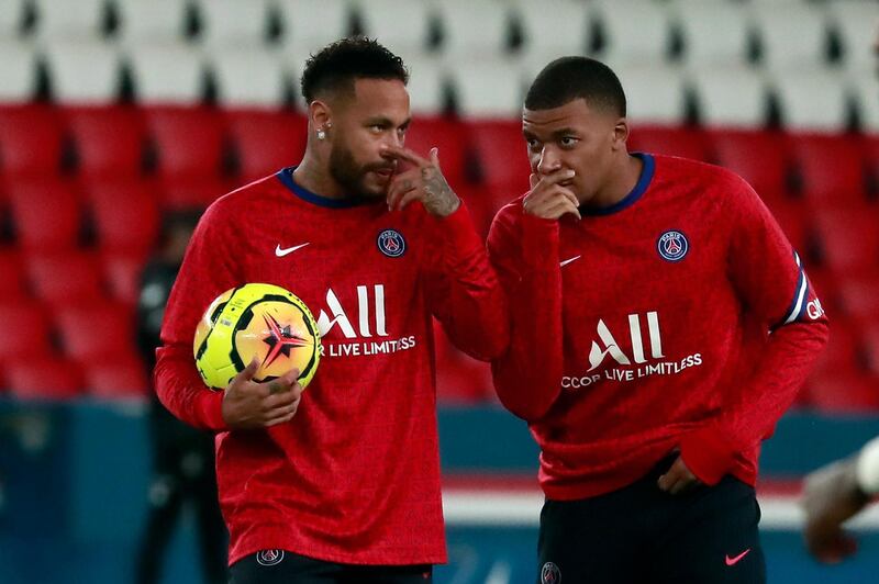 Neymar Jr  speaks with Kylian Mbappe during the warm up. EPA