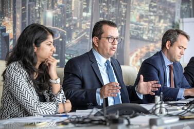  Mohamed Damak, senior director and global head of Islamic Finance (center), speaking during a media roundtable in Dubai on Monday. Antonie Robertson/The National