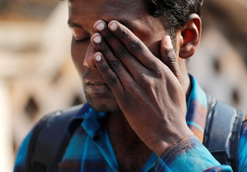 A fan reacts during the funeral procession. Danish Siddiqui / Reuters