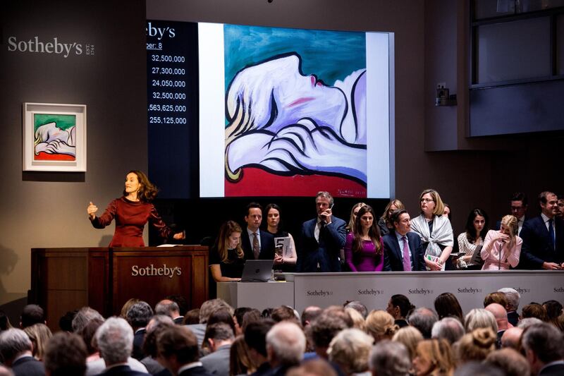 epa06737362 An image of the painting 'Le Repos' by artist Pablo Picasso is displayed during the sales event of The Modern Art Auction at Sothebys auction house in New York, New York, USA, 14 May 2018.  EPA/ALBA VIGARAY