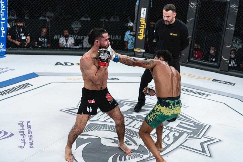 Vinicius de Oliveira, the new UAE Warriors bantamweight champion, reacts after defeating Moroccan Xavier Alaoui at the Jiu-Jitsu Arena on Saturday, March 20, 2021. Courtesy Palms Sports. Action arenâ€™t great (he is in green shorts)