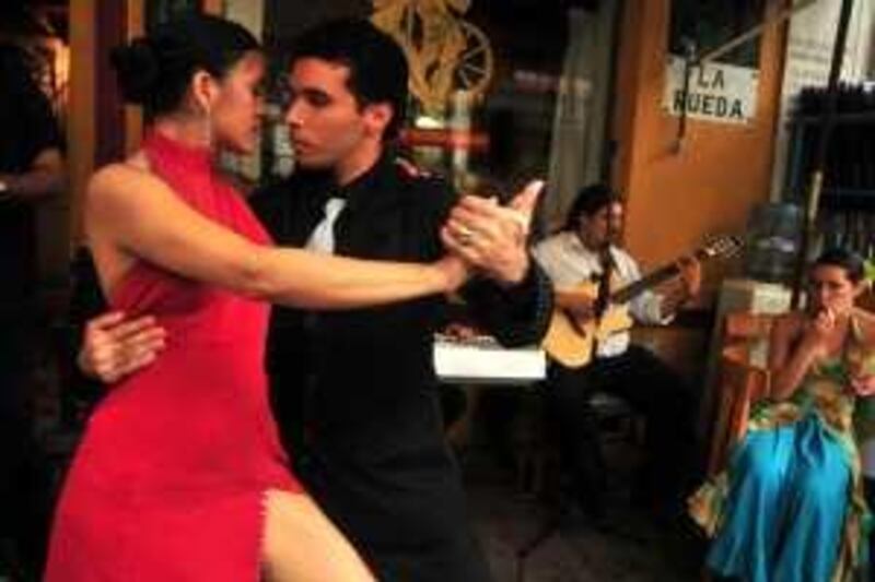 A couple perform a tango dance in the streets of  La Boca district, Buenos Aires, Argentina. *** Local Caption ***  Tango  for Tom Clifford04.JPG