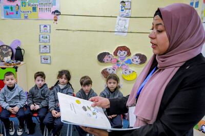 Jordanian teacher Huda Abu Al-Khair reads stories to children in a classroom in Amman. AFP