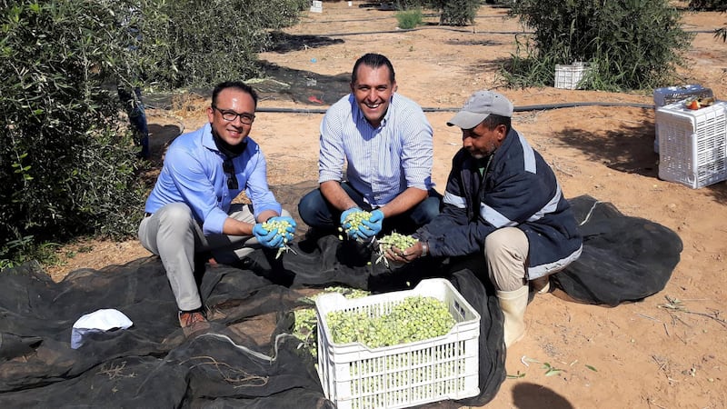 Marwan Odeh, director of food and beverage at Rotana Amman Hotel, and Nico Dingemans with a farmer at Al Zyoud Olive Farm, Zarqa. Photo: Nico Dingemans 