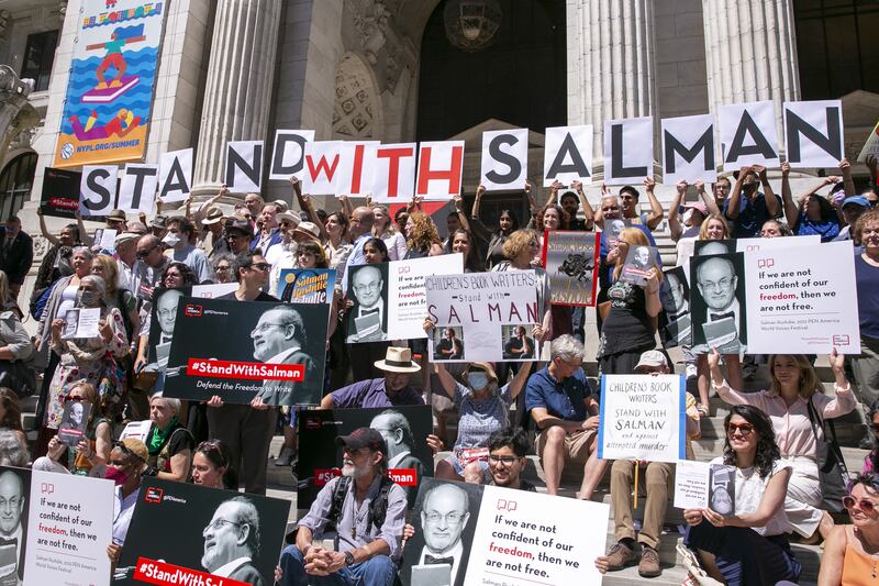 Supporters of writer Salman Rushdie gather outside New York Public Library after he was attacked on stage on August 12. EPA