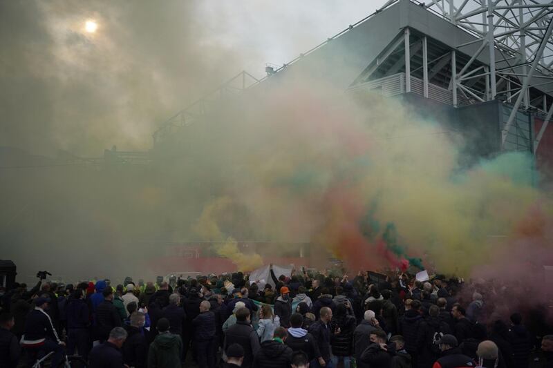 Protesters let off smoke flares outside Old Trafford. Getty