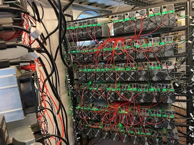 In this photo taken by Matt Lohstroh on May 6, 2021, a bitcoin mining data center is seen on an oil field in North Texas.

 As the value of bitcoin soars and concerns rise about the energy intensive process needed to obtain it, cryptocurrency entrepreneurs in the United States believe they have found a solution in flared natural gas. Profitably creating, or mining, bitcoin and other cryptocurrencies requires masses of computers dedicated to guessing lengthy hexidecimal numbers -- an endeavor that globally consumes more electricity than entire nations, but for which these start-ups say the hydrocarbon-burning torches placed next to oil wells are perfect.
 - RESTRICTED TO EDITORIAL USE - MANDATORY CREDIT "AFP PHOTO / Matt Lohstroh/ HO" - NO MARKETING - NO ADVERTISING CAMPAIGNS - DISTRIBUTED AS A SERVICE TO CLIENTS
 / AFP / Matt Lohstroh / Handout / RESTRICTED TO EDITORIAL USE - MANDATORY CREDIT "AFP PHOTO / Matt Lohstroh/ HO" - NO MARKETING - NO ADVERTISING CAMPAIGNS - DISTRIBUTED AS A SERVICE TO CLIENTS
