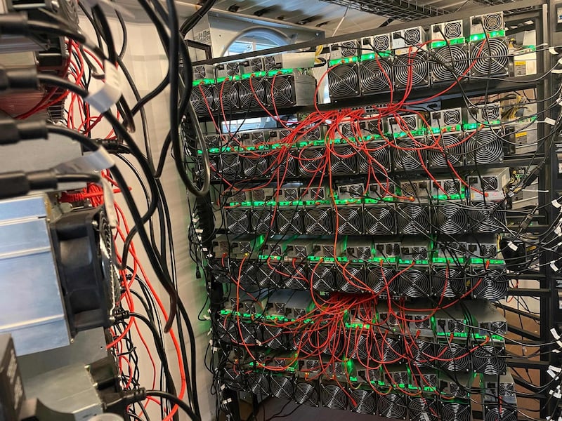 In this photo taken by Matt Lohstroh on May 6, 2021, a bitcoin mining data center is seen on an oil field in North Texas.

 As the value of bitcoin soars and concerns rise about the energy intensive process needed to obtain it, cryptocurrency entrepreneurs in the United States believe they have found a solution in flared natural gas. Profitably creating, or mining, bitcoin and other cryptocurrencies requires masses of computers dedicated to guessing lengthy hexidecimal numbers -- an endeavor that globally consumes more electricity than entire nations, but for which these start-ups say the hydrocarbon-burning torches placed next to oil wells are perfect.
 - RESTRICTED TO EDITORIAL USE - MANDATORY CREDIT "AFP PHOTO / Matt Lohstroh/ HO" - NO MARKETING - NO ADVERTISING CAMPAIGNS - DISTRIBUTED AS A SERVICE TO CLIENTS
 / AFP / Matt Lohstroh / Handout / RESTRICTED TO EDITORIAL USE - MANDATORY CREDIT "AFP PHOTO / Matt Lohstroh/ HO" - NO MARKETING - NO ADVERTISING CAMPAIGNS - DISTRIBUTED AS A SERVICE TO CLIENTS
