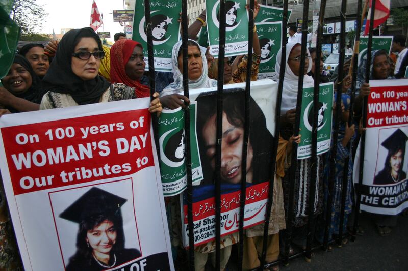 People rally in Karachi in 2011 demanding the release of Aafia Siddiqui, who was convicted in February 2010 of two counts of attempted murder. AP file