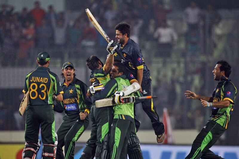 The release of pressure in a big game was evident when Pakistan got to celebrate a narrow win over arch-rivals India with the help of Shahid Afridi, centre, and man-of-the-match Mohammad Hafeez, right, on Sunday, March 2, 2014. AM Ahad / AP Photo