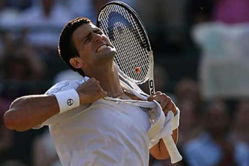 Novak Djokovic celebrates after a 7-5, 6-4, 3-6, 6-4 victory over Lleyton Hewitt.