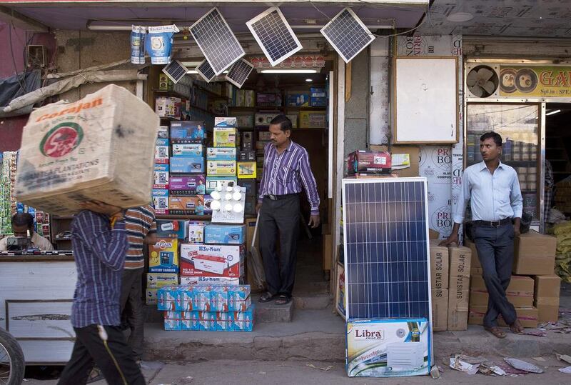 Solar panels being displayed for sale at a market in New Delhi. India has unveiled plans to boost renewable energy capacity in the next five years, ahead of a UN climate change conference in Paris. Saurabh Das/AP Photo