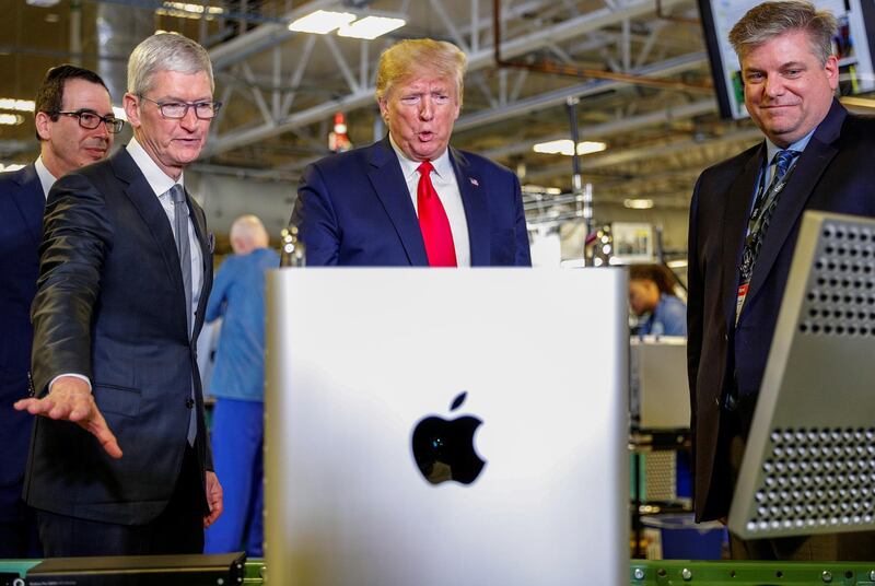 Apple CEO Tim Cook escorts U.S. President Donald Trump as he tours Apple's Mac Pro manufacturing plant with in Austin, Texas, U.S., November 20, 2019. REUTERS/Tom Brenner