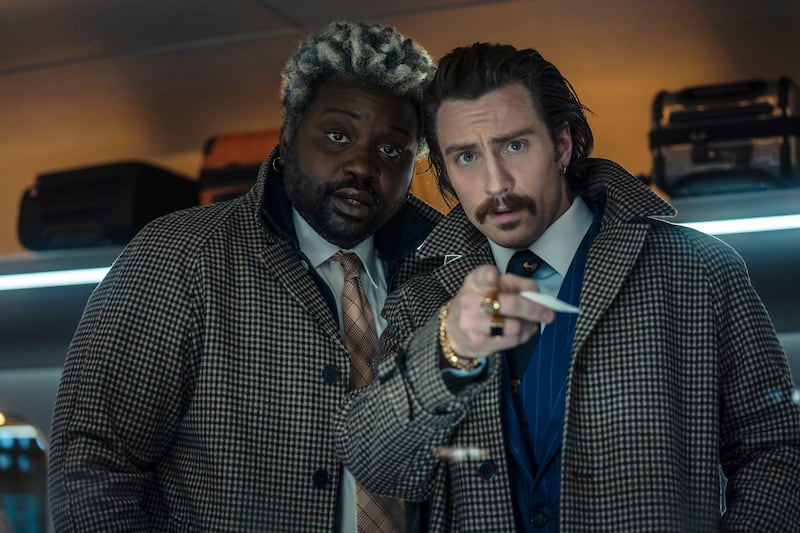 Brian Tyree Henry, left, and Aaron Taylor-Johnson play cockney British 'twins' Lemon and Tangerine. 