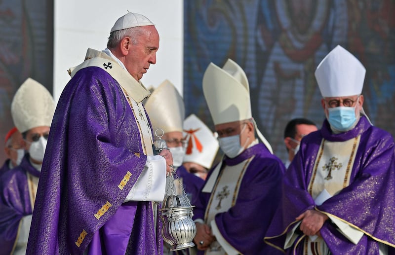 Pope Francis walks with an incense censer as he leads mass at the Franso Hariri Stadium. AFP