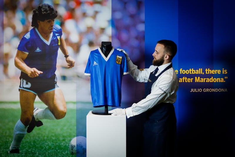 Diego Maradona’s 1986 World Cup shirt is displayed at Sotheby's as it goes up for auction. Getty