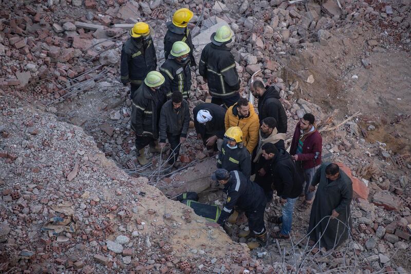 Rescue team at work in the aftermath of a residential building collapse in Gesr Al Suez, Cairo. EPA