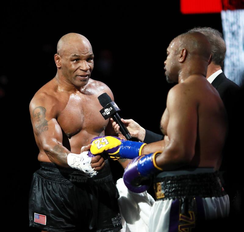 Mike Tyson shakes hands with Roy Jones, Jr. after their split draw. Reuters