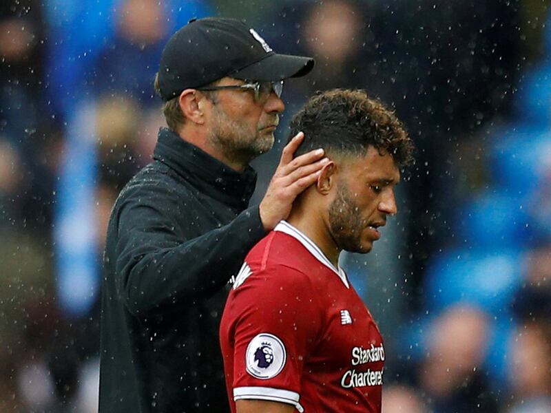 Soccer Football - Premier League - Manchester City vs Liverpool - Manchester, Britain - September 9, 2017   Liverpool’s Alex Oxlade-Chamberlain with manager Juergen Klopp after the match    REUTERS/Phil Noble  EDITORIAL USE ONLY. No use with unauthorized audio, video, data, fixture lists, club/league logos or "live" services. Online in-match use limited to 75 images, no video emulation. No use in betting, games or single club/league/player publications. Please contact your account representative for further details.     TPX IMAGES OF THE DAY