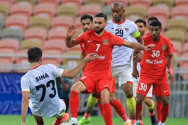 Shabab's midfielder Ahmad Nourollahi (C) vies for the ball with Foolad's midfielder Sina Moridi (L) during the AFC Champions League group C match between UAE's Shabab Al-Ahli and Iran's Foolad on April 10, 2022, at the King Abdullah Sports City stadium in the Saudi city of Jeddah.  (Photo by AFP)