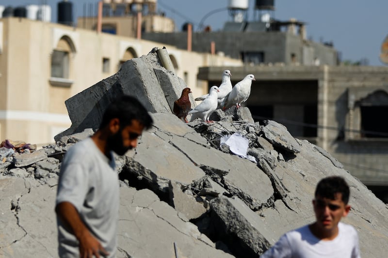 Rescuers look for casualties in Khan Younis. Reuters