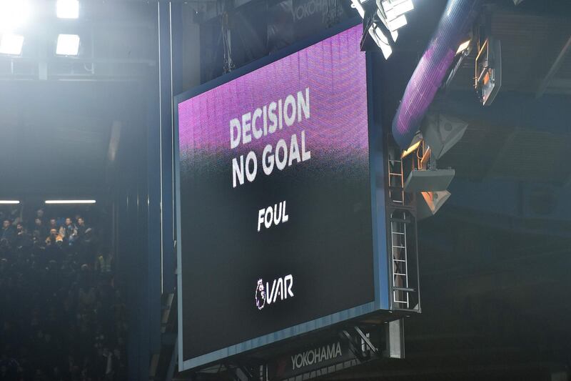 The big screen displays the decision after a VAR  review, disallowing a goal from Chelsea's French defender Kurt Zouma for a foul in the build-up. AFP