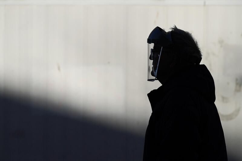 A man wearing a face shield walks through Hull city centre. Getty Images