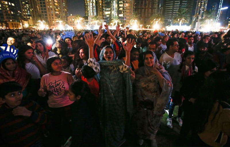 People gather near to Burj Khalifa  prior to the fireworks.  EPA