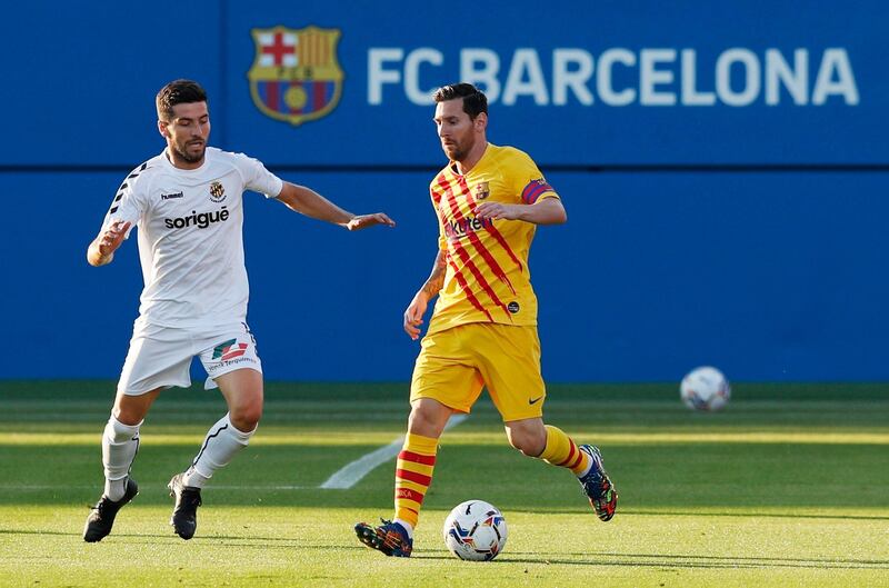 Lionel Messi on the ball during Barcelona's pre-season friendly against Gimnastic. Reuters