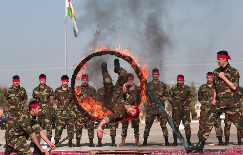 Iraqi-Kurdish Peshmerga officers graduate in Erbil, the capital of Iraq's autonomous Kurdish region. All photos: AFP