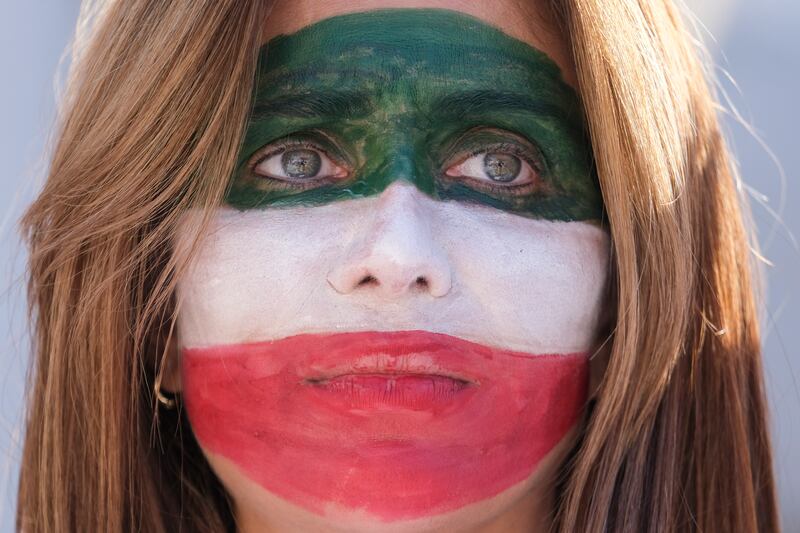 A woman with the colours of the Iranian flag painted on her face participates in a rally as thousands demonstrate in support of Iranian women in Los Angeles. EPA