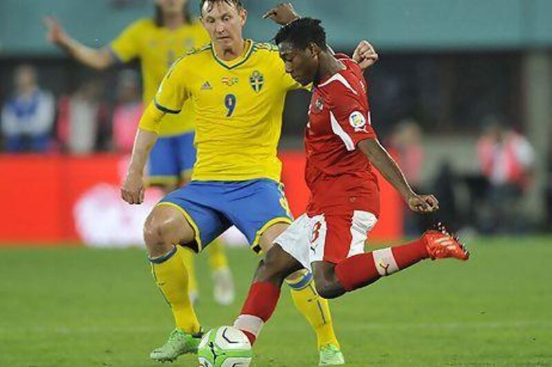 A win tonight for David Alaba, right, and his Austria teammates will close the gap on group leaders Germany.  Samuel Kubani / AFP