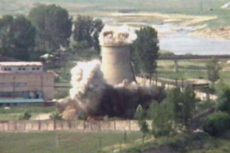 This image from television shows the demolition of the 18-metre-tall cooling tower at its main reactor complex in Yongbyon, North Korea.