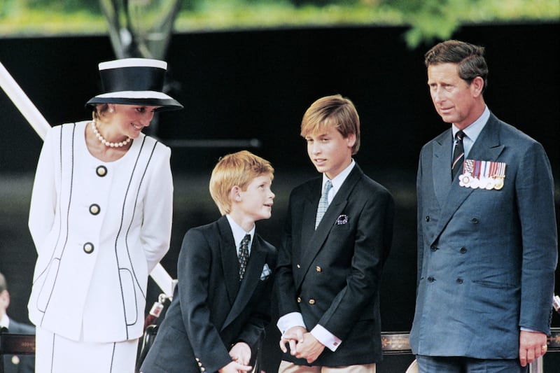 Prince Charles, Princess Diana and their children watch the march past on the mall as part of the commemorations of VJ Day in London in 1995. AFP