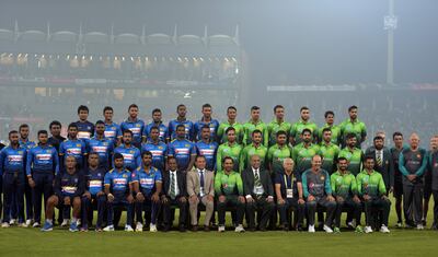 Pakistani and Sri Lankan cricketers and officials pose for a photograph before the start of the third and final Twenty20 international match at the Gaddafi Cricket Stadium in Lahore on October 29, 2017.
The Twenty20 against Sri Lanka may take less than four hours to play but its significance could last far longer -- convincing major nations that it is safe to tour Pakistan again. Sri Lanka are the first top eight team to visit Pakistan, eight years after they were the last -- caught up in a deadly attack by militant gunmen outside Gaddafi stadium in Lahore. / AFP PHOTO / AAMIR QURESHI